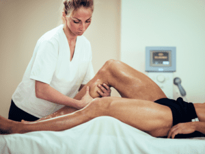 A man getting an in-home sports massage from a Tranquil, a mobile massage company in Las Vegas and Los Angeles, after doing a sports massage near me search online