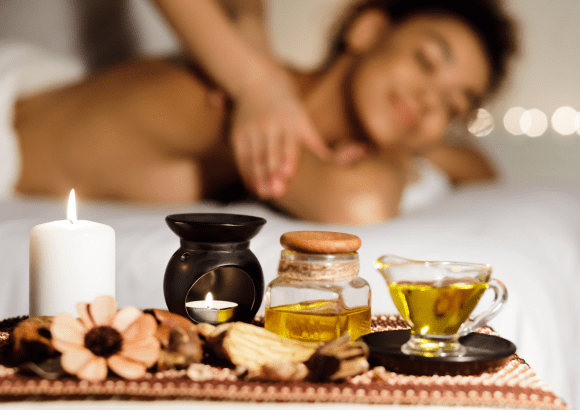 A woman having a cbd oil massage at home