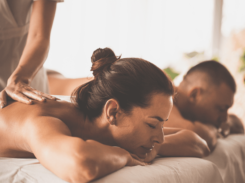 A couple receiving a couples massage in Los Angeles outside