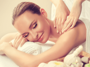 A woman receiving an affordable in-room massage in Los Angeles