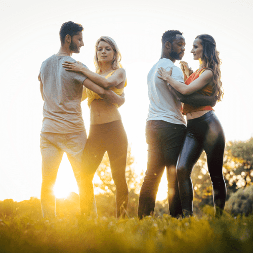 A diverse group of massage therapist dancing at a park in Summerlin Las Vegas