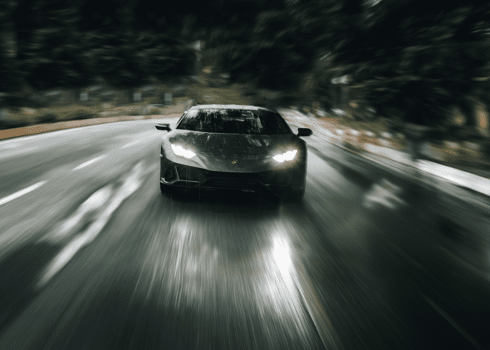 This picture of a couple racing in a black Lamborghini represents something cool and crazy for couples to do in Las Vegas