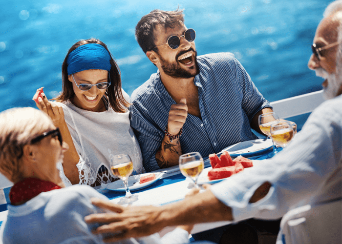 This a picture of a group of people on a dinner cruise in LA that represents a once in lifetime thing to do in Los Angeles
