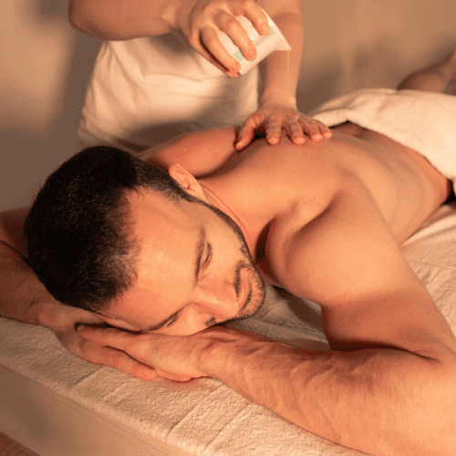 A man enjoying a massage at his home in Downey, CA