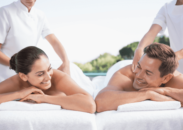 A couple getting a poolside massage in Glendale, CA at their home