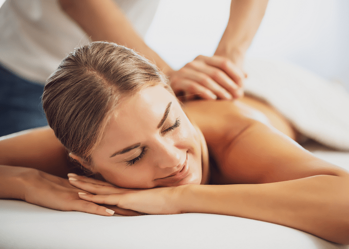 A woman having a massage to reduce her symptoms of depression